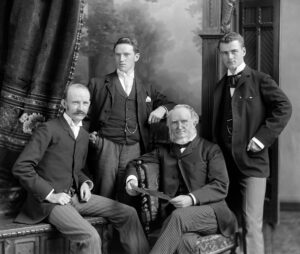 Patriarch William Norman, third from the left, pictured a few months before his death with his three sons (who all worked for his studio)